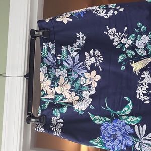 Beautiful summer skirt with back slit and falls right below the knee